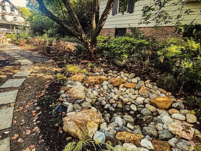 Residential drainage with subsurface drainage renovation, rain garden basin creation, native landscape design and install and boulder wall addition project in lansdowne, pa